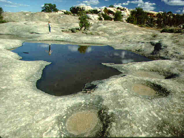  weathering pits form where water collects and accentuates rates of 