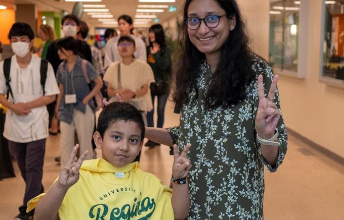 A woman and child posing for the photo