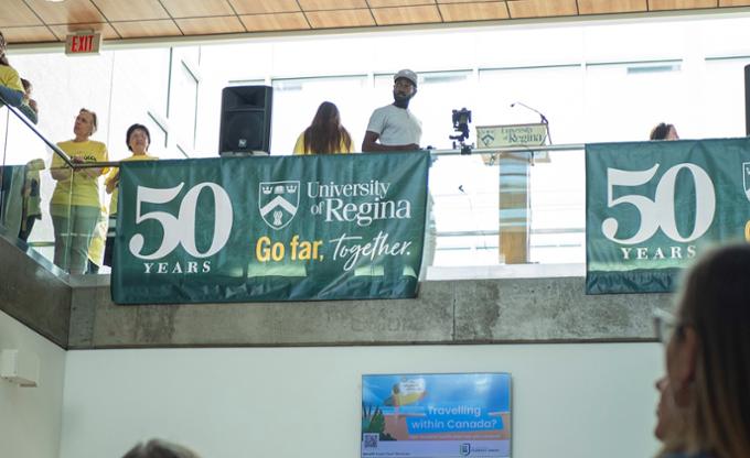 People standing on an upper floor