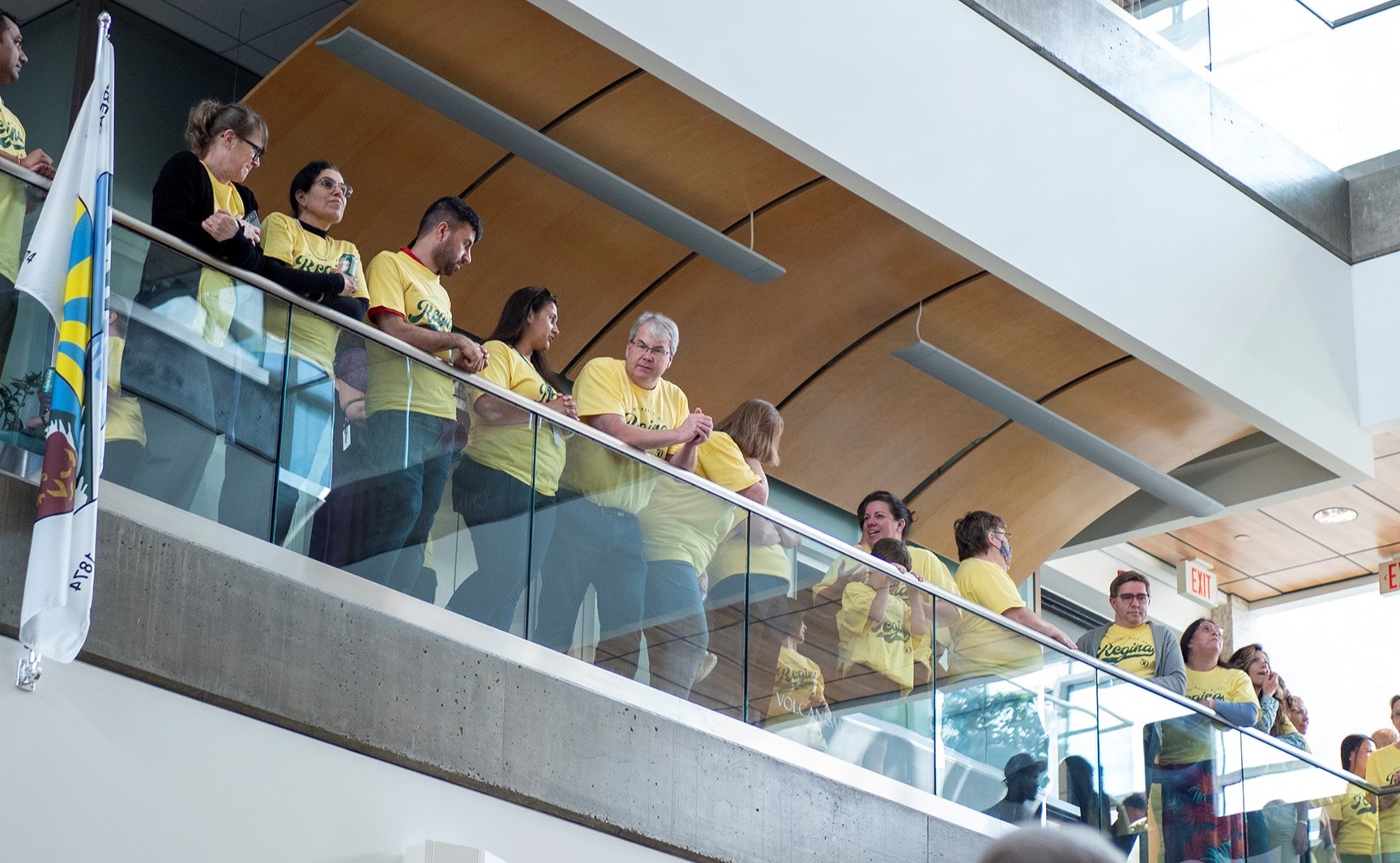 People standing on an upper floor