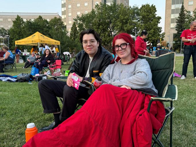 two people sitting for the camera