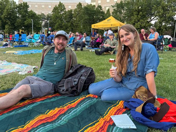 two people sitting for the camera