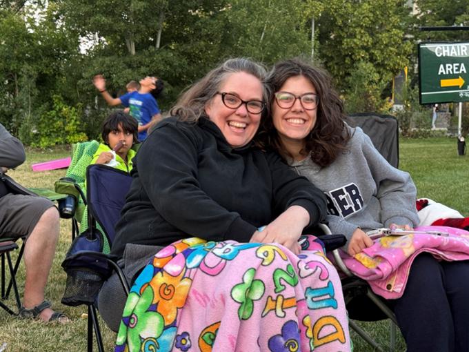 two people sitting on chairs