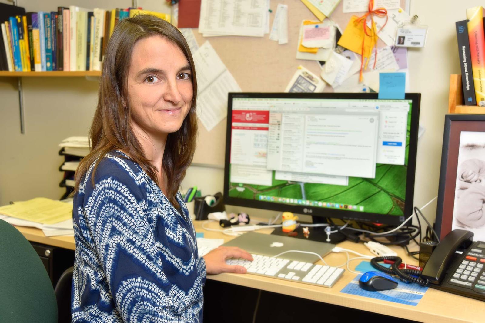 Person at desk using a computer