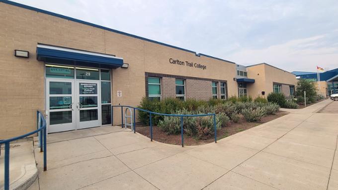 A wide shot of the front of a college building