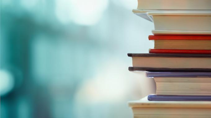 Stack of books with the pages out on the right hand side