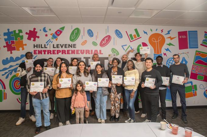 Participants pose for a picture with their Fail UP certificates.