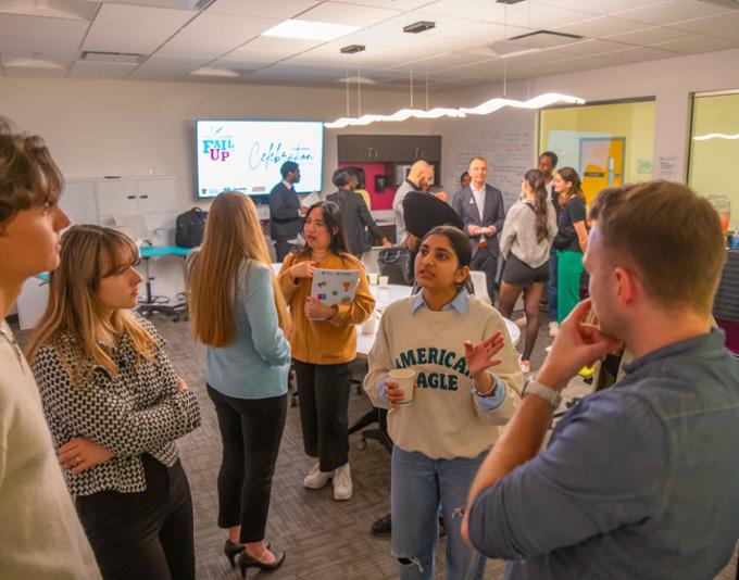 Attendees are chatting at the Wrap-up Celebration.