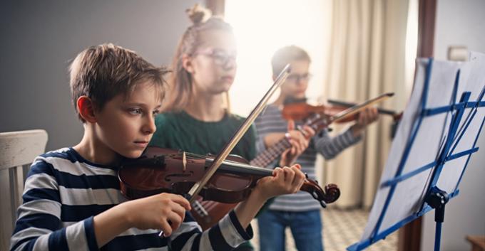 Children learning the violin