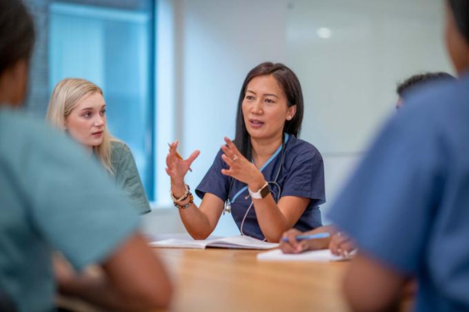 Nurse talking to her team