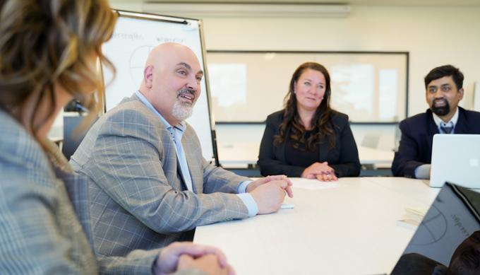 Career and Professional Development staff talking at a table together.