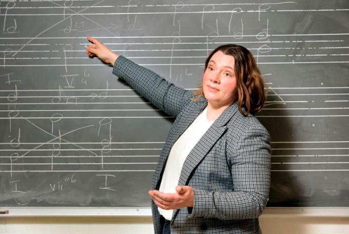 person pointing at a board