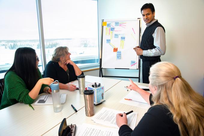 students in a meeting room