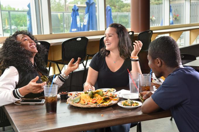 students eating in restaurant