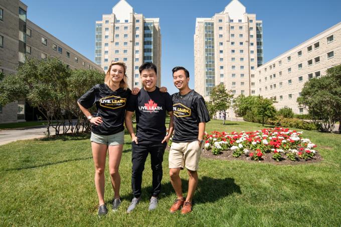 three students outside in live-learn t-shirts