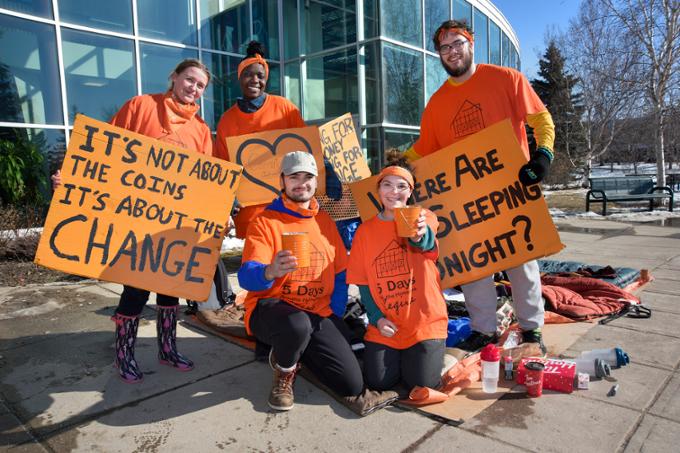 students in orange shirts