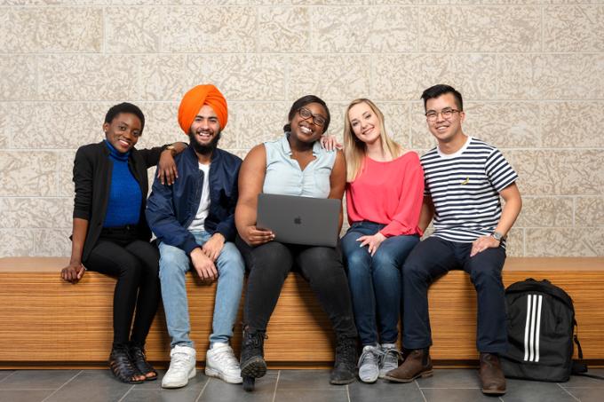 students sitting on bench