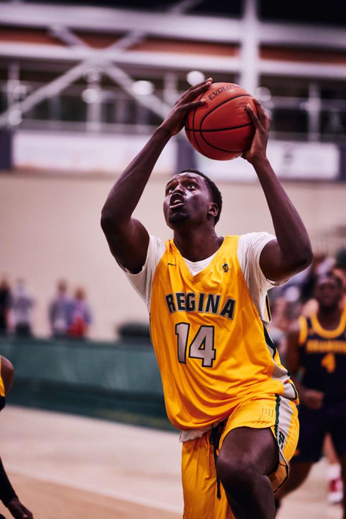 Cougars men's basketball player with ball