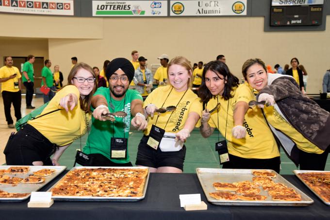 students in gym with food