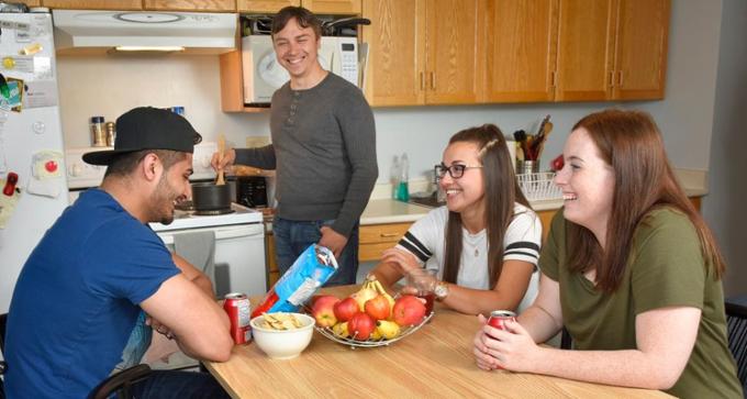 students at table in dorm