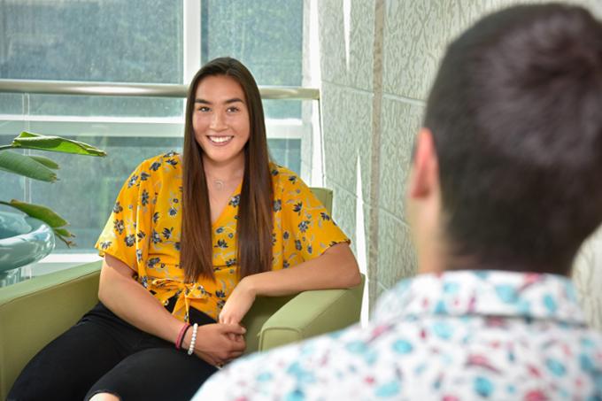 Two students sitting and talking