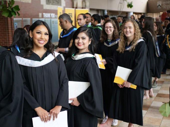 Students wearing conovation robes