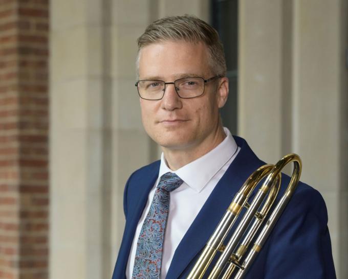 Head shot of man with a trombone