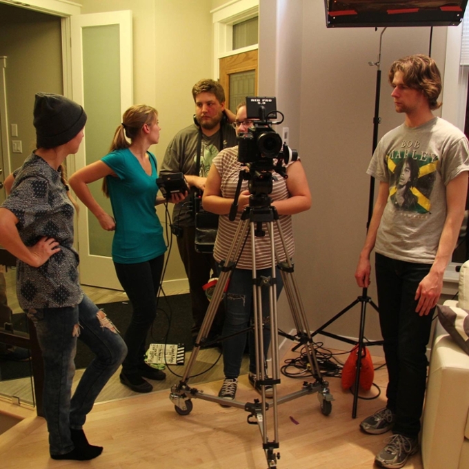 Students filming in a house