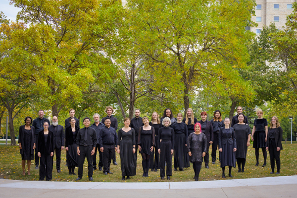 The music choir standing outside in their performance attire