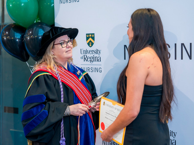 graduate receiving an eagle feather