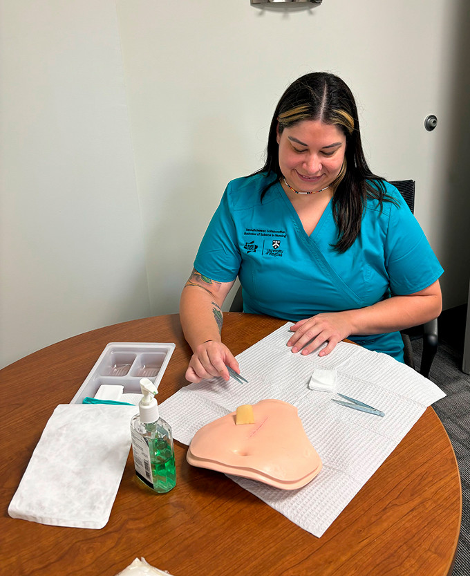 Nursing student demonstrating suture technique