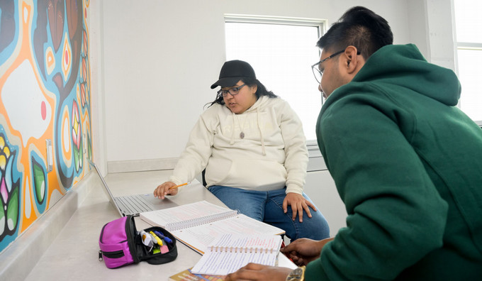 Students sitting and conversing in a study space