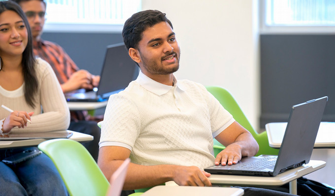 students sitting in desks in a classroom