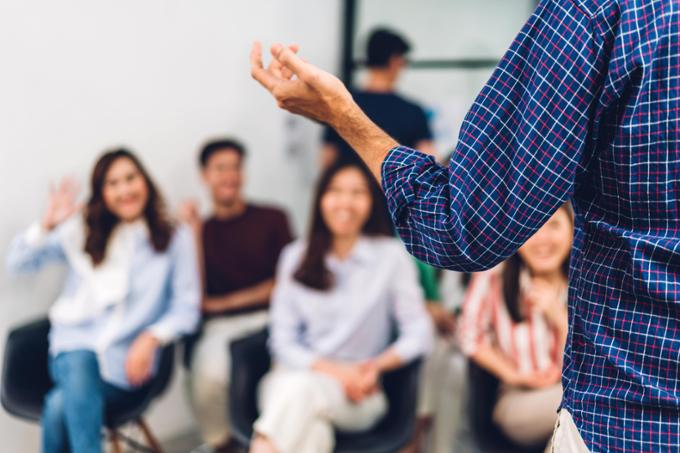 A person speaking to a group. 