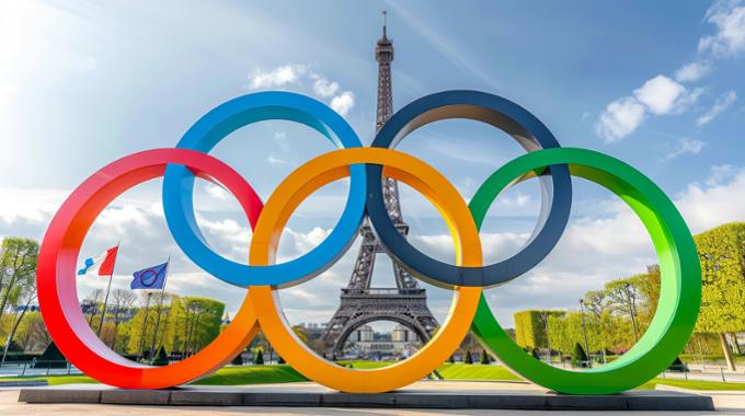 Graphic of the Olympic rings superimposed over the Eiffel Tower