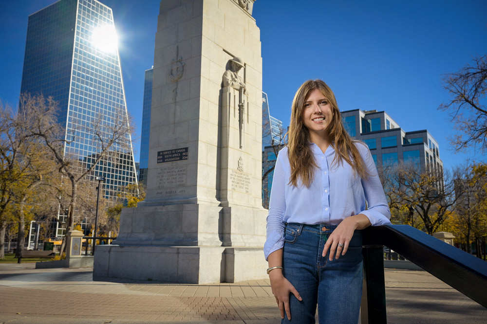 A person standing in front of a monument