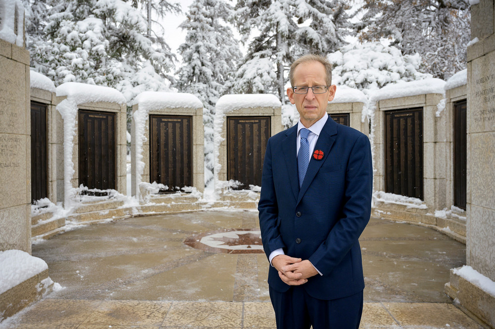 Person standing in front of memorial.