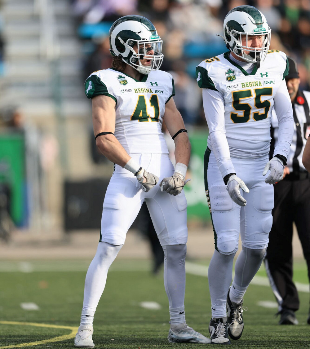 Two football players on the field.