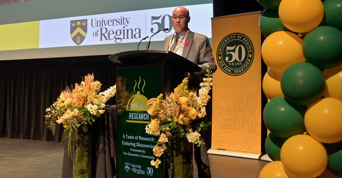 A person at a podium in front of an audience