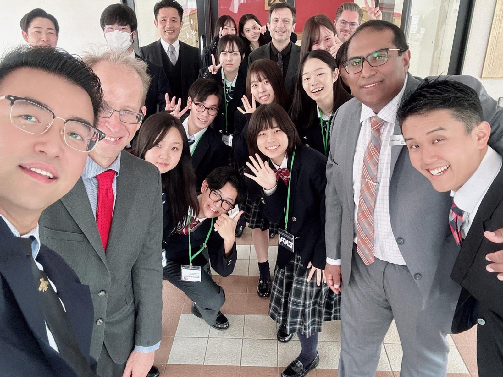 Japanese students pose with U of R delegates in a hallway