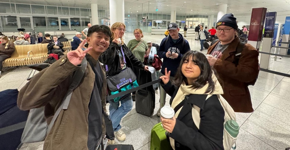 A group of individuals in an airport.