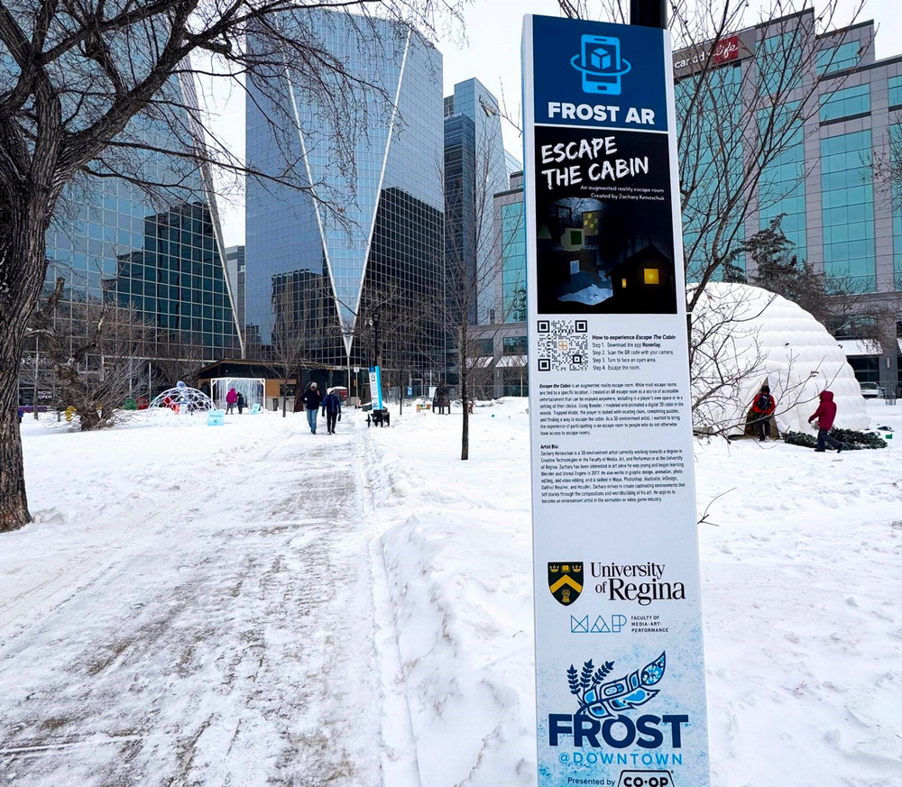 a sign in a snowy park