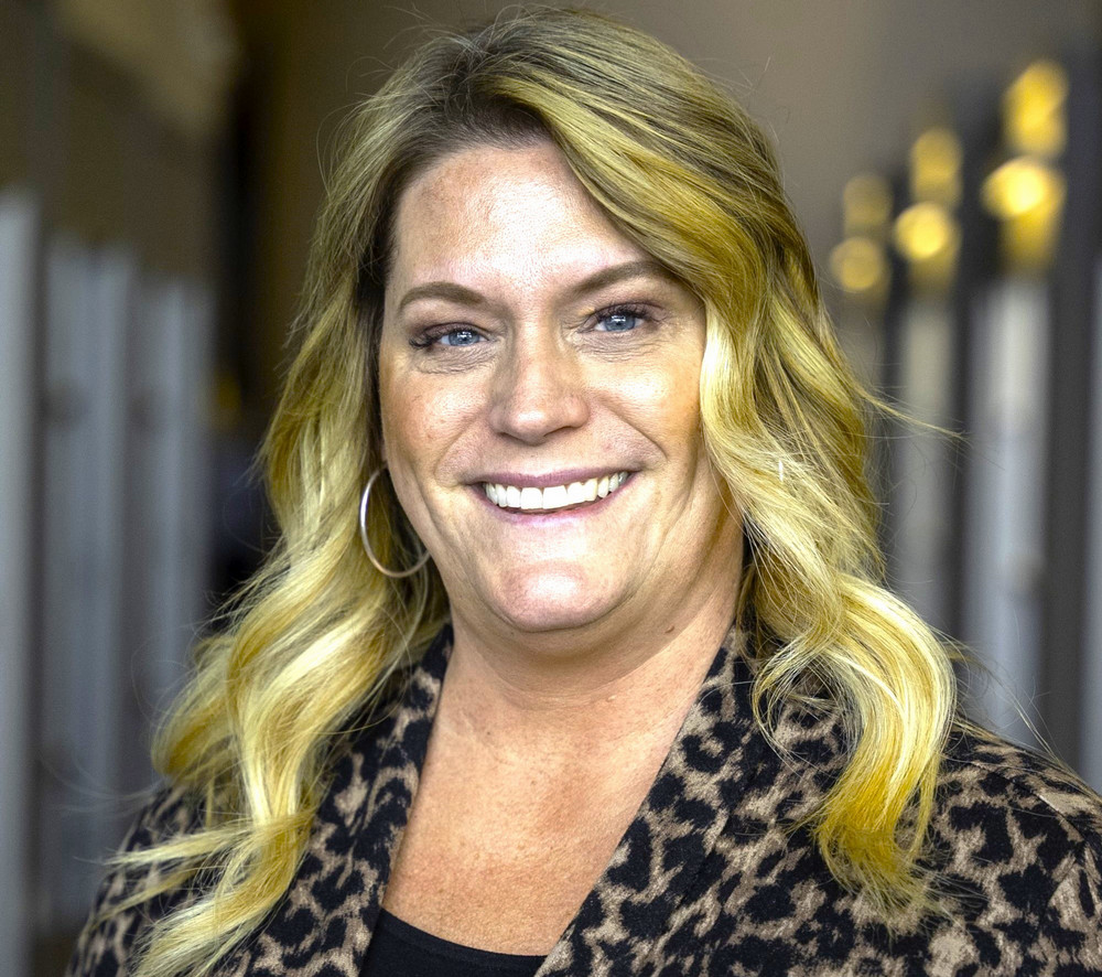 Headshot of smiling woman in professional attire.