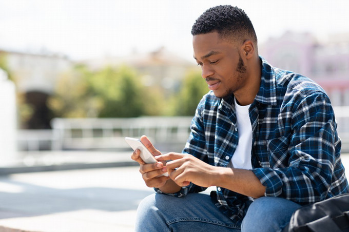 student texting on phone