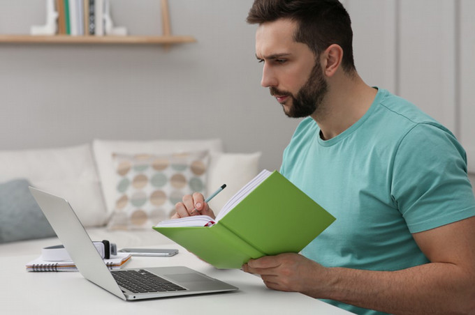 person looking at book