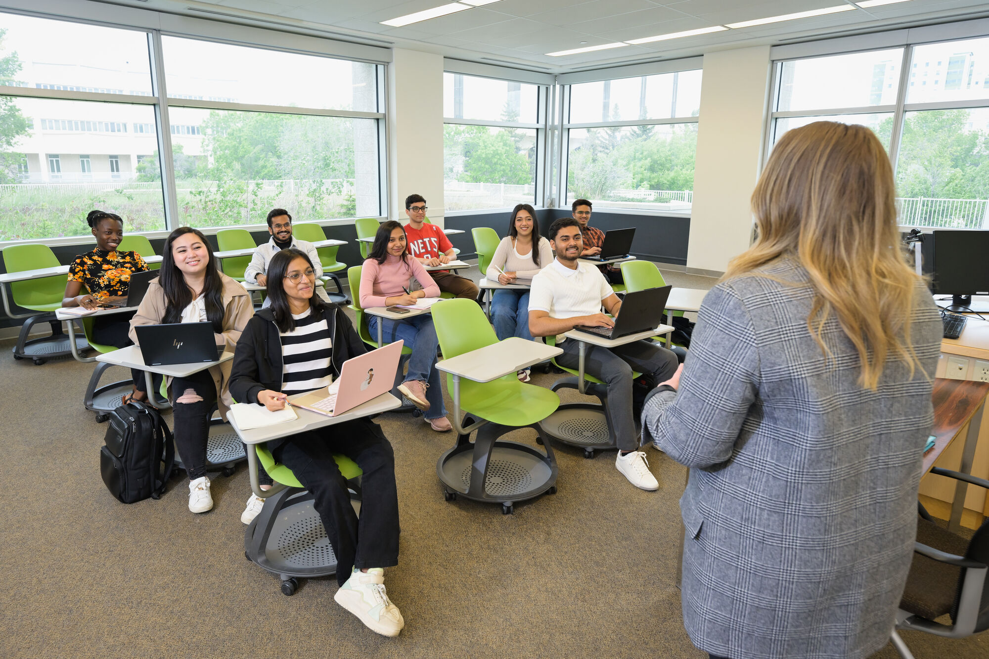 students in classroom listening to instructor