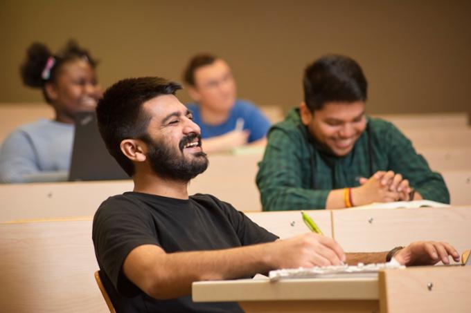 Boy laughing in a classroom