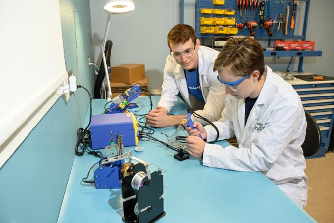 Two boy working on an engineering project