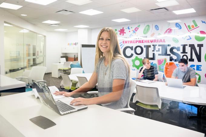 Student in business with laptop