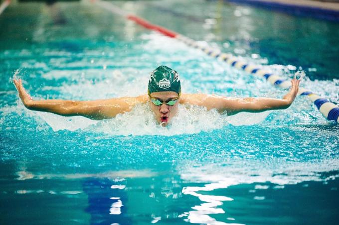 Student athlete swimming.